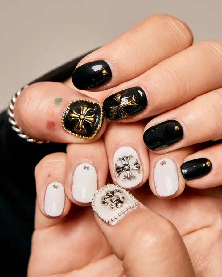 Black and white nail art with embellishments